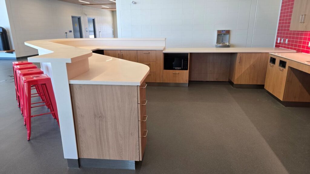Modern reception desk design for 2026 World Cup venue.